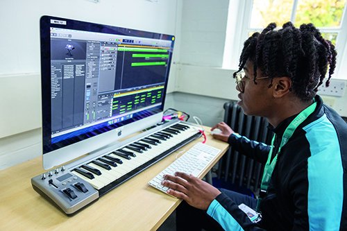 Uxbridge student working on a music file