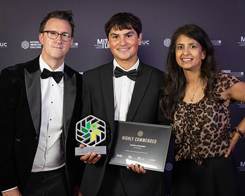 Xavier Choudhry holding his Highly Commended award for the National Innovation Challenge with Keith Smith, HRUC CEO and Konnie Huq, former Blue Peter TV presenter, and STEM ambassador. Xavier is dressed in a tuxedo.