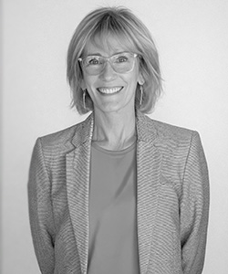 Helen Walker - she is wearing glasses with a jacket and t-shirt  