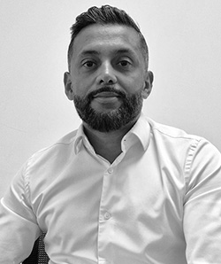 Iqbal Vaza - Chief Executive, The Education Space - wearing a white shirt with a white background behind him. 