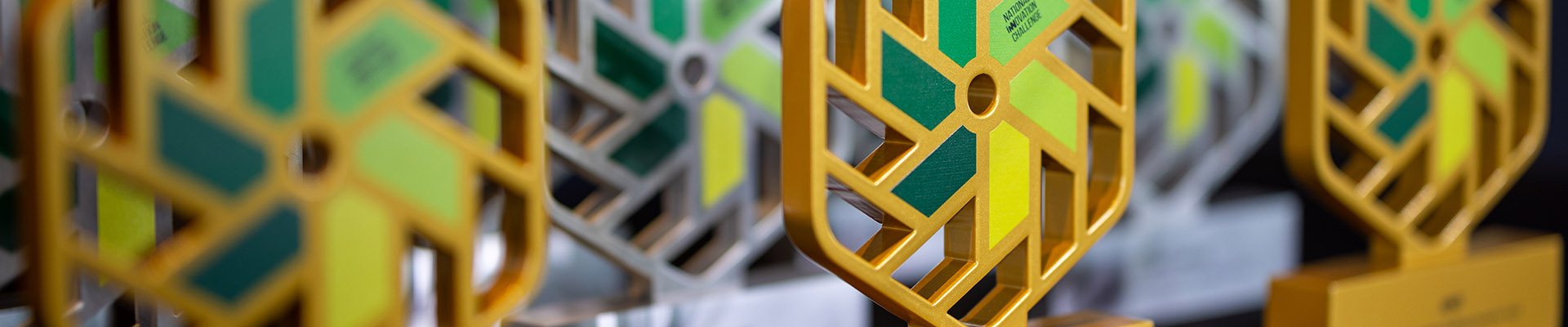 National Innovation Challenge awards on a table