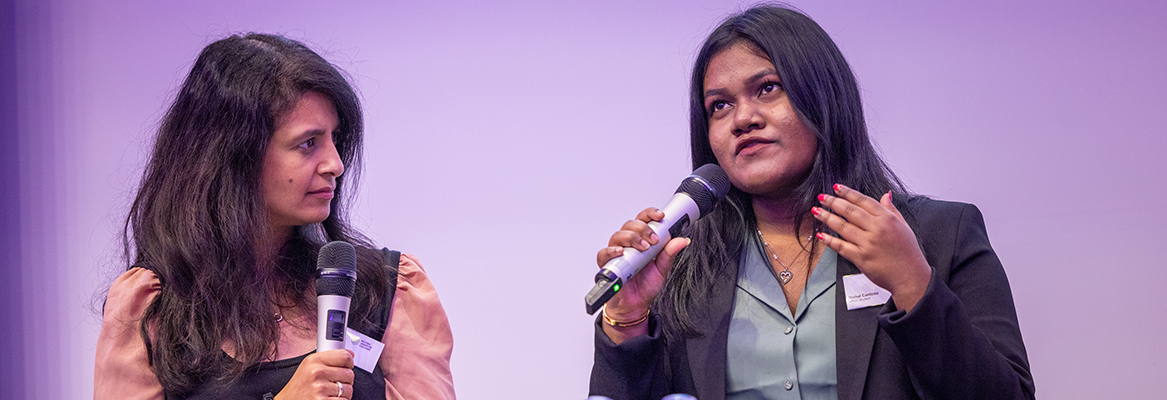 Konnie Huq talking with HRUC students from the National Innovation Challenge competition launch event