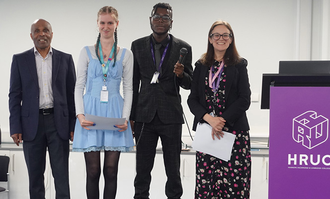 Bianca Fanciullacci, Head of School for English and Maths with Cecil Browne, Joshua Kandapah and a female Uxbridge College English GCSE student. She is holding her certificate for the Young Writers Stranger Sagas competition.