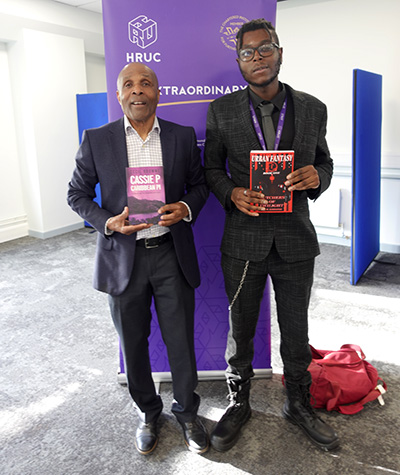 Cecil Browne, former Head of Maths at Uxbridge College and Joshua Kandapah, Digital Innovation Facilitator at HRUC holding their own books they have written.
