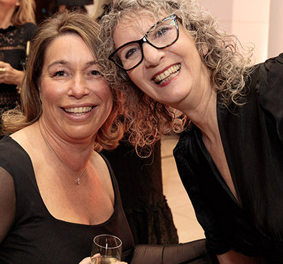 Jo Withers, Chief of Business Strategy at HRUC with Apprentice of the Year Winner, Joanne McSweeney. Both wearing black with big smiles. 