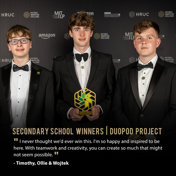 NIC 2026 Schools Category winners - Timothy, Ollie and Wojtek from St Bede’s Catholic High School holding thier trophy and standing in front of a backdrop full of logos.